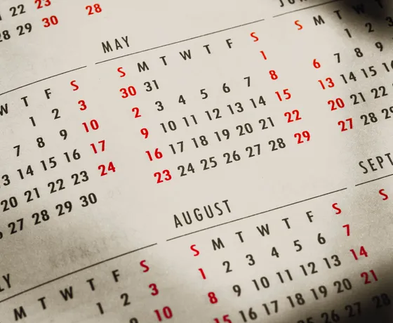 Close-up of printed calendar months and dates